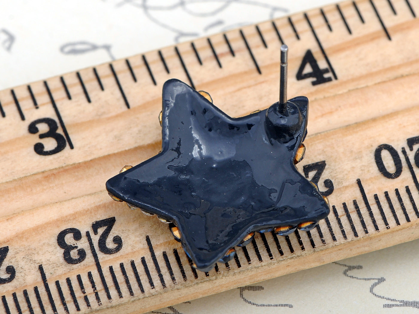 Black Colored Abstract Shape On Star Twinkle Element Earrings