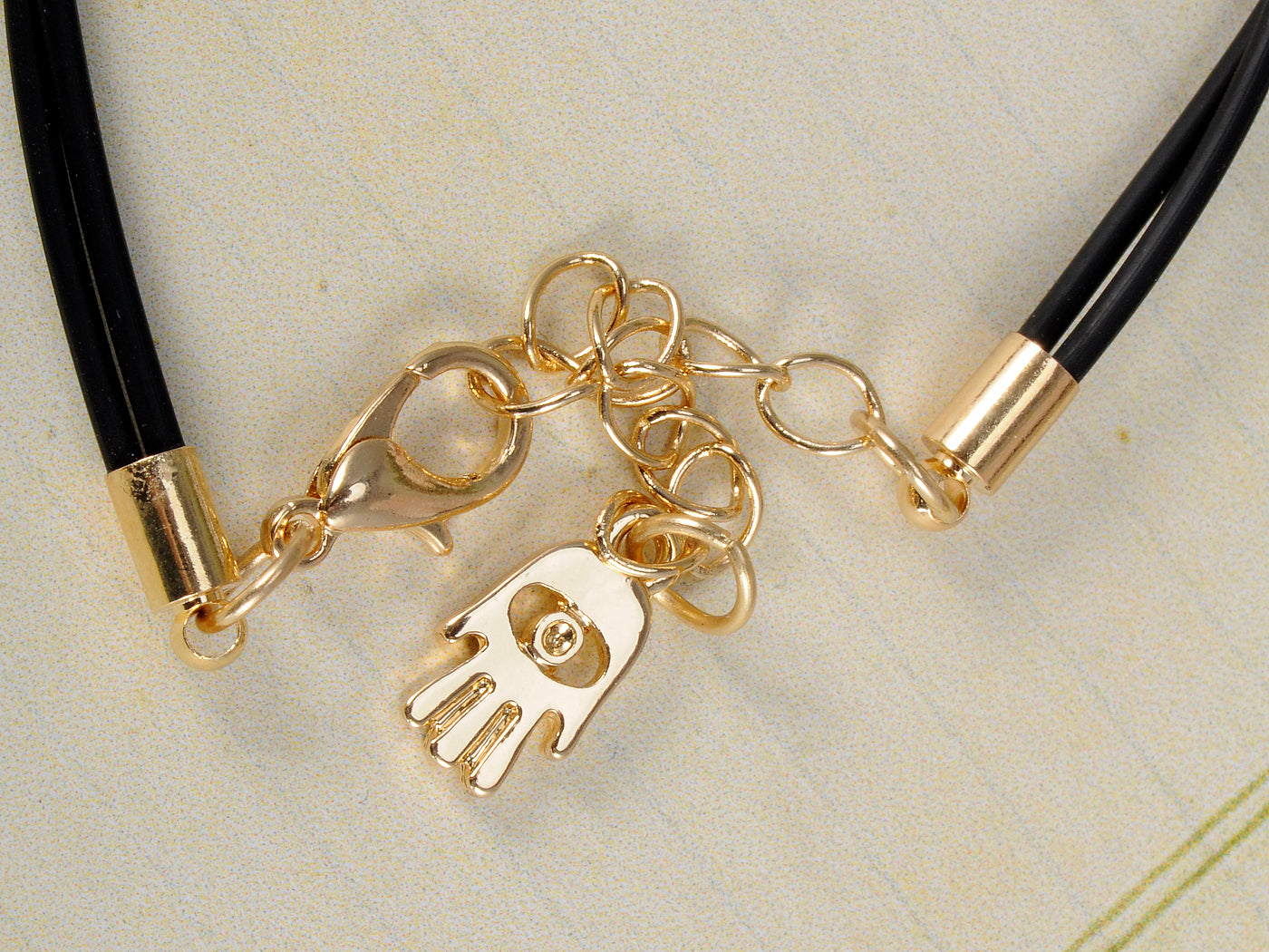 Intricate Carved Hamsa Charm Holding Blue Bead Palm Black String Bracelet