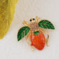 Alilang Elegant Crystal Rhinestone Fruit and Bee Brooch - Fashionable Gold Plated Fruit Insect Lapel Pins for Dresses and Accessories