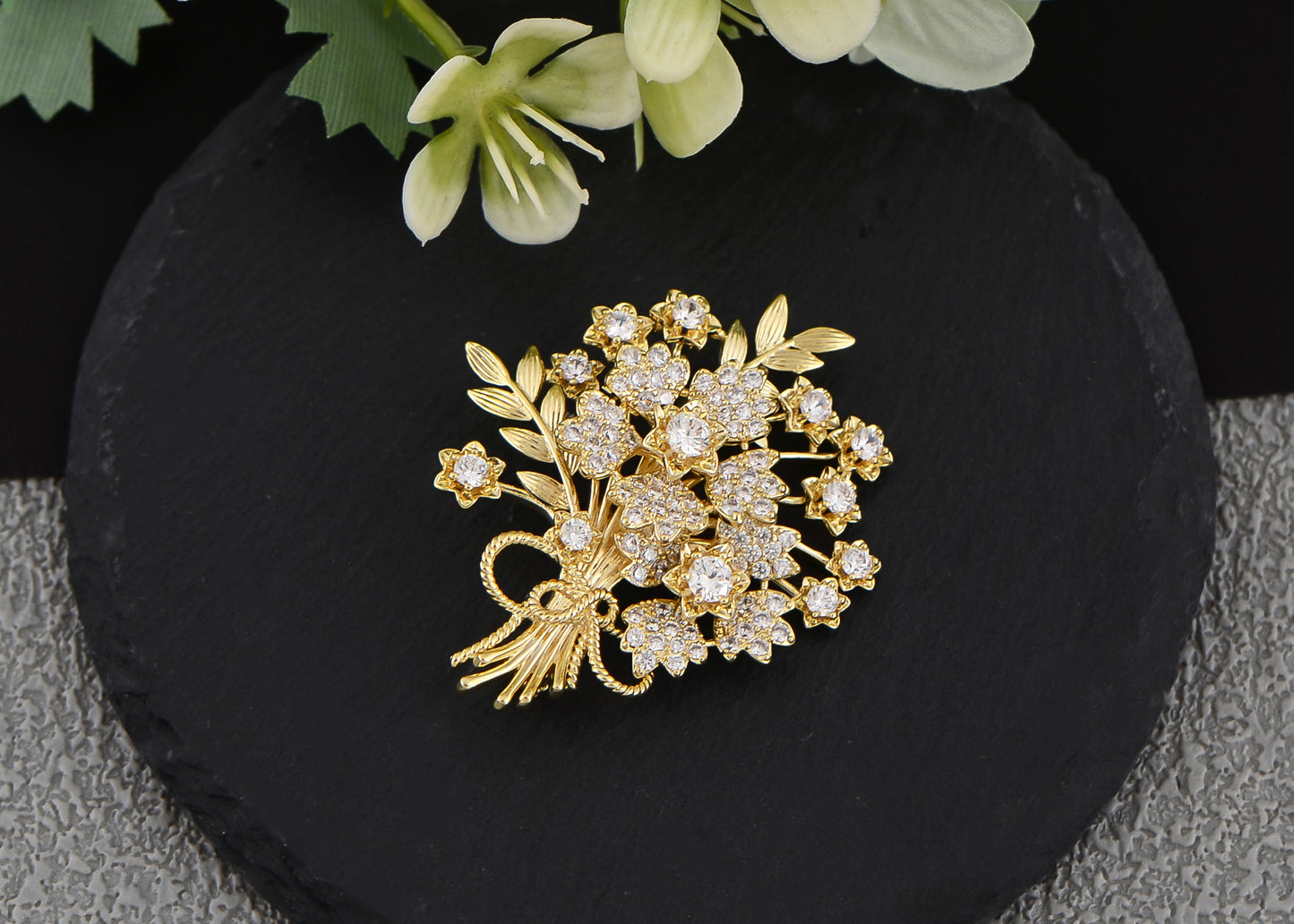 Aliang Women Gold Tone Floral Bouquet Brooch with Clear Rhinestone Textured Leaf and Bow Details