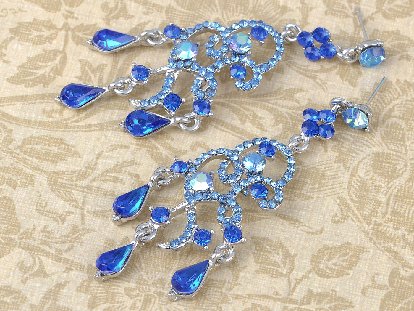 Silver Sapphire Blue Colored Sea Swirl Waves Dangle Earrings